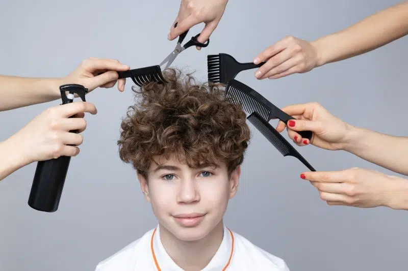 a teenager with hairdressing tools around his head 2024 1