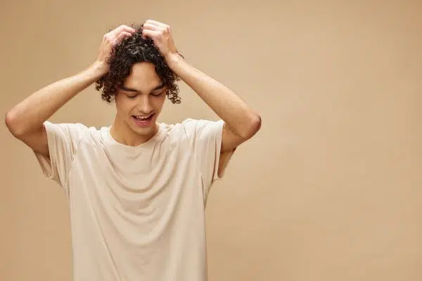 funny awesome tanned curly man in basic t shirt