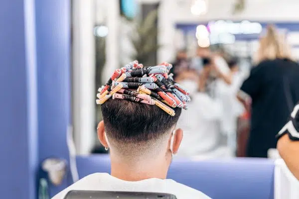 head of a man full of rollers to dye the hair 2